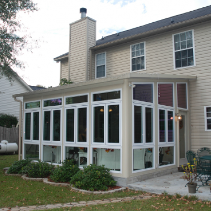 Patio enclosure with specialty windows